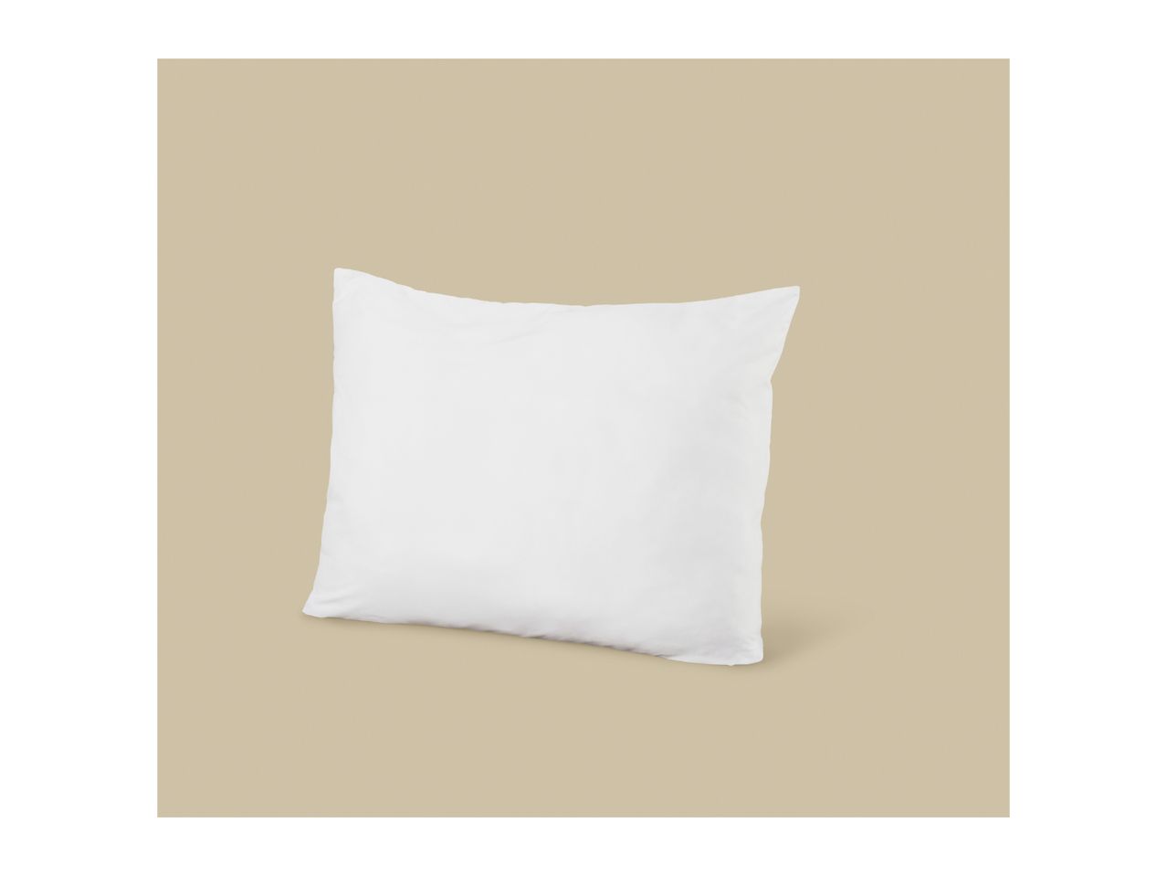 White pillow on a beige background