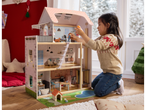A child plays with a Lupilu wooden doll's house, featuring multiple rooms and accessories.
