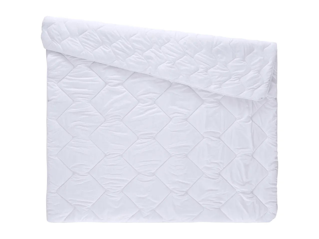 White quilted duvet, partially folded, on a white background.