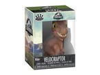 A Jurassic World Velociraptor vinyl figure in its display box.