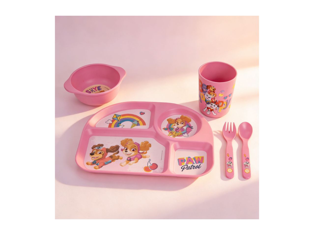 Pink children's dining set with Paw Patrol characters, including a bowl, plate, cup, fork, and spoon.