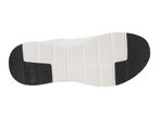 Bottom view of a white and black athletic shoe sole with textured patterns.