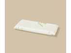 A white bamboo pillow with green text and leaf patterns, on a light brown background.