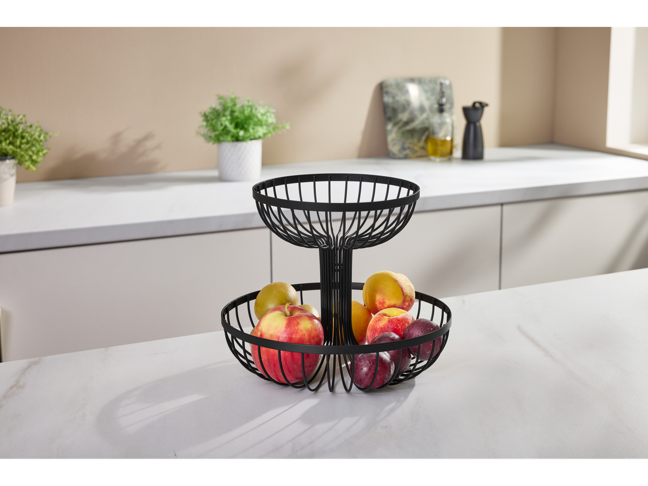 SILVERCREST® Fruit Basket with various fruits on a kitchen counter