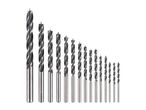 A set of various sized wood drill bits, arranged from largest to smallest.