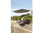 Livarno Garden Sofa Set with a grey umbrella and coffee table on a patio.