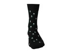 Black sock with a pattern of small green pine trees with snow on top
