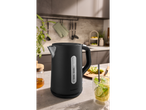Black SILVERCREST® kettle on a kitchen counter with a drink and honey jar