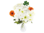 A bouquet of white chrysanthemums and orange gerbera daisies with a shamrock pick.