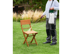 Parkside® Garden Pressure Sprayer being used to clean a wooden chair in a garden.