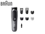 Grey trimmer with multiple black and white comb attachments and a cleaning brush.