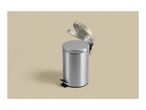 Silver stainless steel pedal bin with the lid open on a beige background.