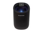 Compact black air purifier with a glowing blue light and a power button on top.