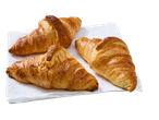 Três croissants dourados de manteiga sobre um guardanapo branco.
