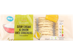 A package of Rivercote Sour Cream & Onion Rice Crackers, 100g, with nutritional information.