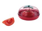 A red plastic tomato keeper with a sliced tomato beside it.