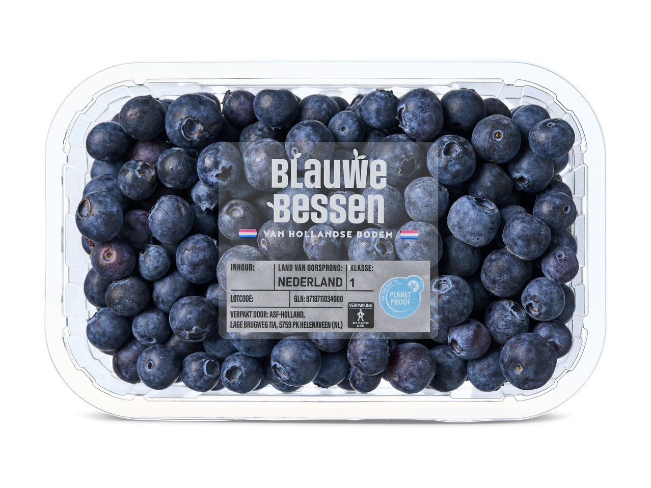 Een doorzichtige plastic bak met blauwe bessen, met een etiket met de tekst 'Blauwe Bessen van Hollandse Bodem' en productinformatie.