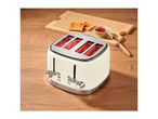 Cream-colored 4-slice toaster with glowing heating elements on a wooden table.