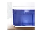Close-up of a dehumidifier water tank filled with water on a wooden table