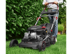 A Parkside Performance lawnmower cutting green grass.
