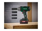 PARKSIDE cordless impact wrench with four sockets on a wooden workbench.