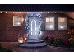 Livarno Home LED string lights illuminate a house entrance with lanterns and plants.