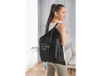 Woman with a black Livarno Home backpack.