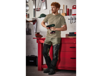 Man in Parkside workwear using a Parkside drill in a workshop.