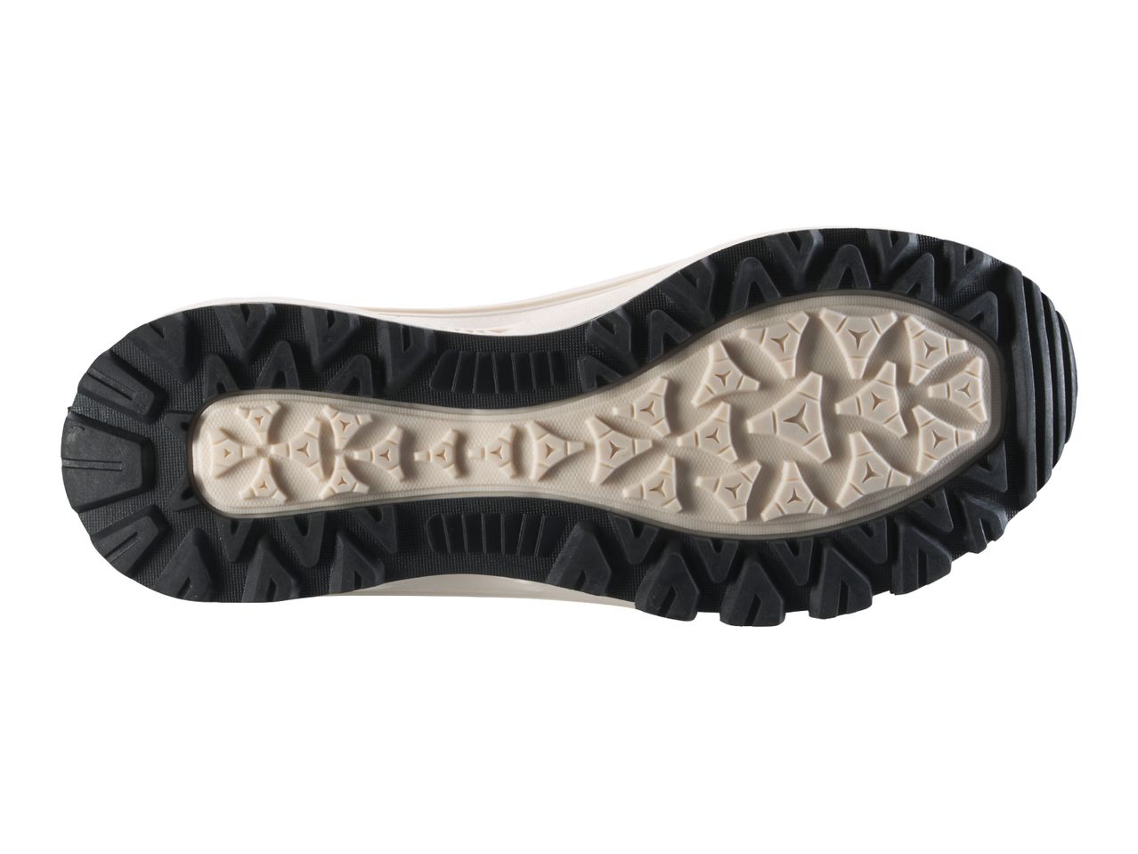 Sole of a shoe with a black and beige tread pattern