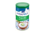 Tzatziki seasoning mix with a bowl of tzatziki and olives on a blue and white checkered cloth.