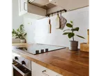 LIVARNO home Self-Adhesive Wall Tiles in a kitchen with wooden countertops and plants.