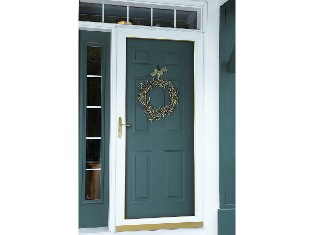 Green door with a wreath hanging from a 3M Command hook