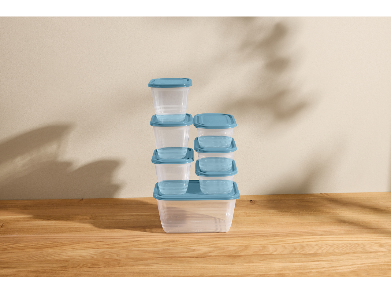 SILVERCREST® Food Storage Container Set with blue lids, stacked on a wooden surface.
