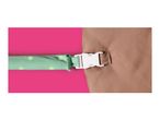 A green polka dot strap with a white buckle attached to a brown fabric.