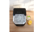 SILVERCREST® Ice Maker with ice, water with mint, and orange juice on a wooden surface.