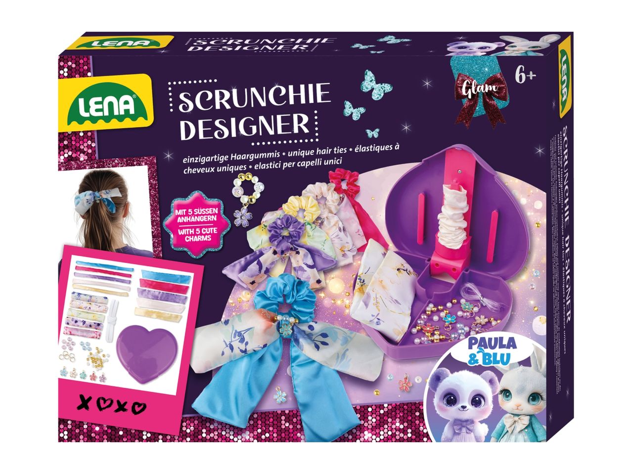 Scrunchie designer kit with fabrics, charms, and tools for making unique hair ties, featuring cute animal characters.
