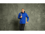 Man in a blue Crivit thermal softshell jacket and black pants.