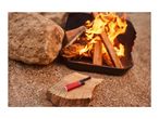 Red lighter on a wooden log next to a campfire in a fire pit.