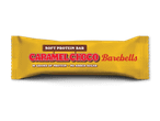 En gul proteinbar med teksten 'SOFT PROTEIN BAR CARAMEL CHOCO' og '16 GRAMS OF PROTEIN NO ADDED SUGAR'.
