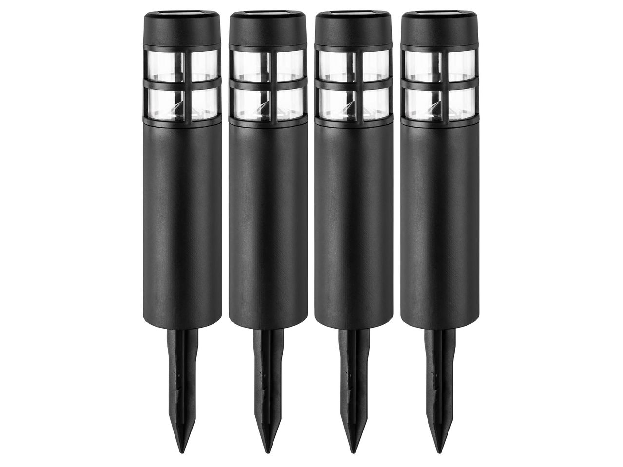 Four black solar-powered garden lights with clear, gridded tops and ground stakes.