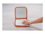 A person cleaning a reusable drawing board with colorful doodles on a wooden surface.