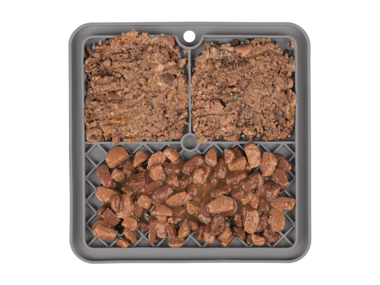Grey pet food lick mat with two types of wet dog food: pate and chunks in gravy.