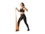 Woman in black sportswear exercising with an orange resistance band.