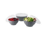 Three gray bowls with white lids, filled with berries and salad.