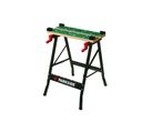 A Parkside workbench with a green work surface and red clamps.