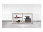 Two metal shelving units with tools, work boots, and storage boxes