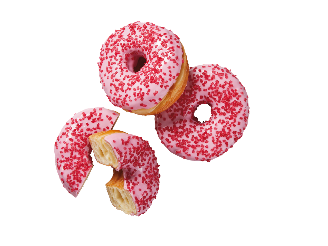 Roze cronuts met rode hagelslag, één heel en één in stukken gebroken.