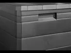 Dark gray plastic storage box with lid.