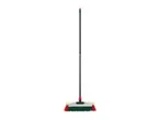A broom with a black handle and red and green bristles.