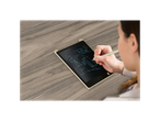 A woman uses a stylus to draw architectural plans on a LCD writing tablet.